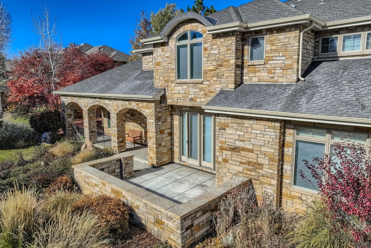 Natural stone veneer and James Hardie fiber cement siding exterior renovation by Northern Lights Exteriors in Lafayette, Colorado, featuring premium stone cladding and custom masonry details