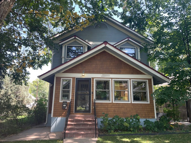 Before photo of a Longmont CO home before James Hardie Artisan siding installation by Northern Lights Exteriors