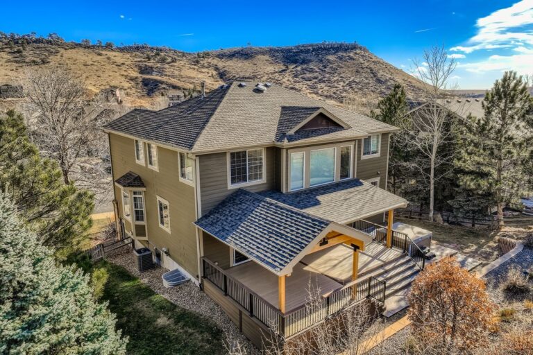 Class-A fire rated covered deck with tongue-and-groove ceiling and integrated lighting over a hot tub patio in Lyons, Colorado by Northern Lights Exteriors