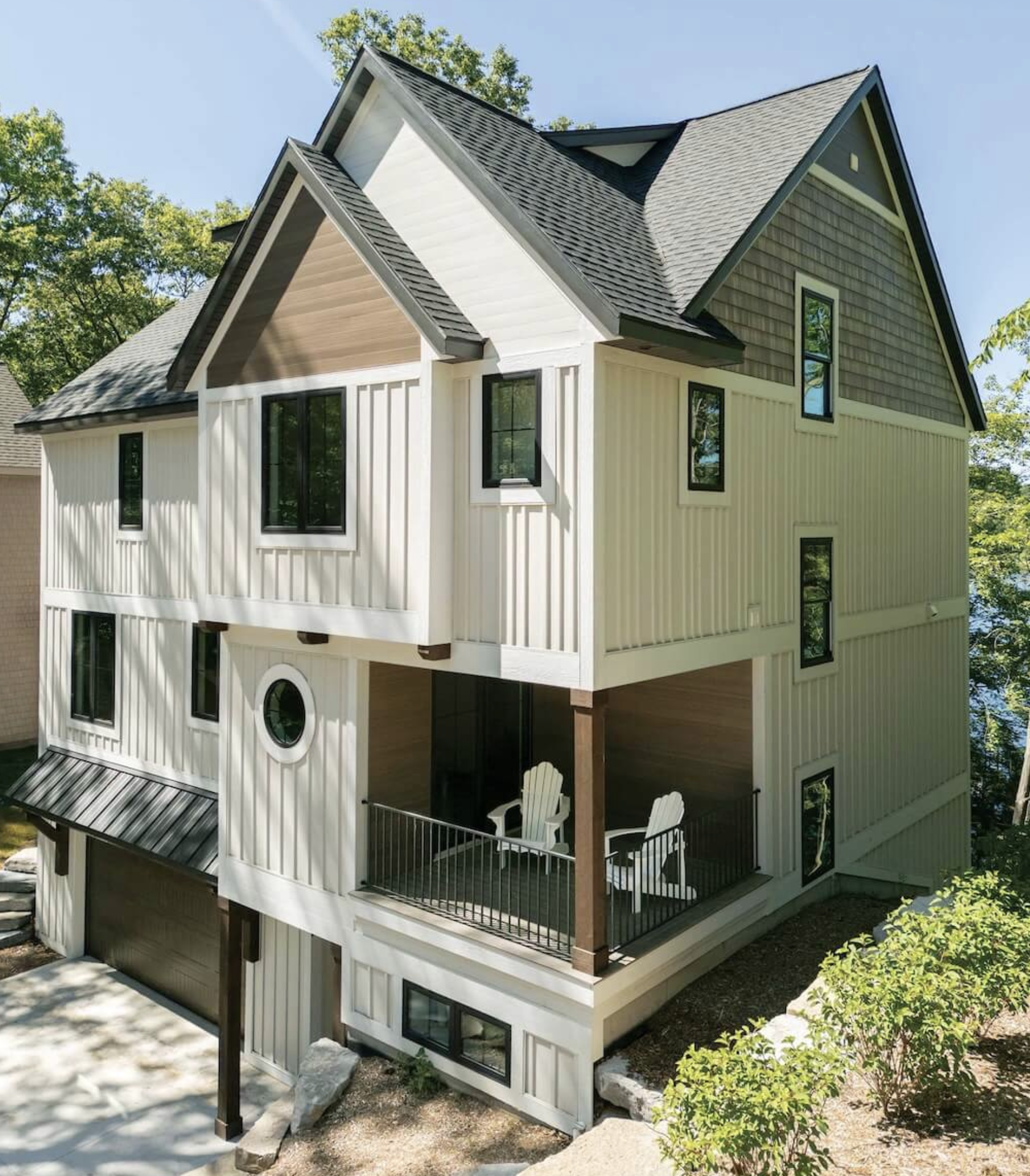 Modern mixed-material exterior design inspiration featuring vertical board and batten siding, cedar-look shingle shake accents, Vesta steel siding details, and contemporary mountain architecture combining multiple premium cladding materials