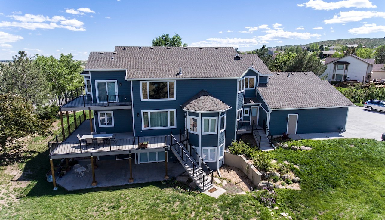 Multi-level custom composite deck designed for mountain views — built in Northern Colorado by Northern Lights Exteriors