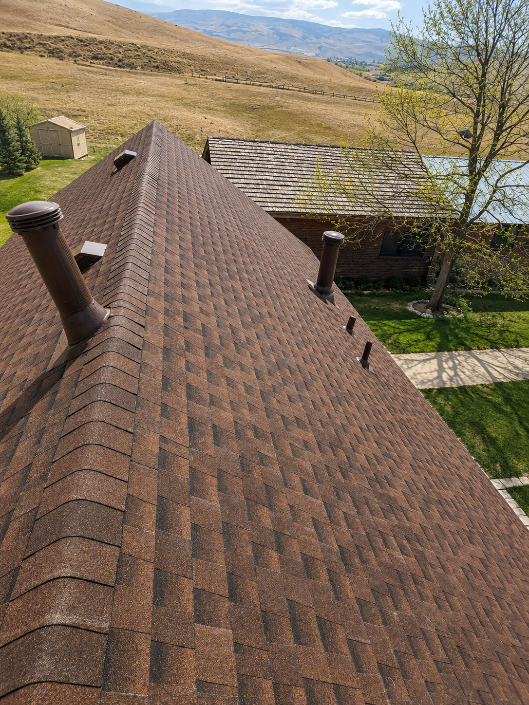 Berthoud, Colorado home featuring a new Owens Corning Class 4 impact-resistant asphalt shingle roof installed by Northern Lights Exteriors following hail storm damage. This roof replacement provides enhanced protection against Colorado hail, high winds, snow, and severe weather while restoring the home's beauty and long-term performance.