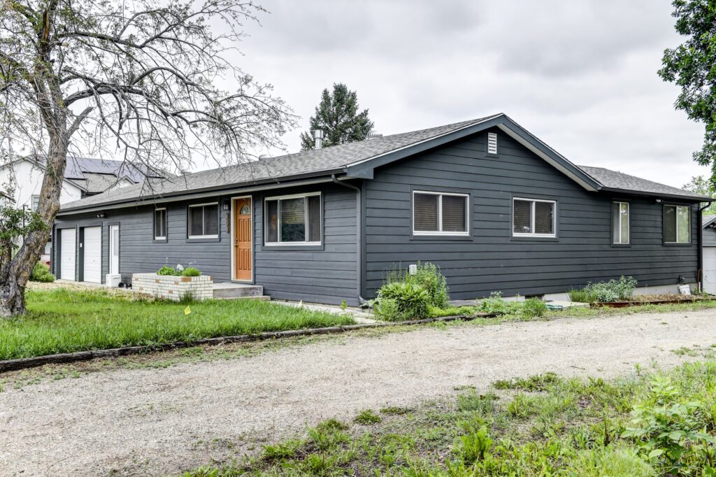 Fort Collins, Colorado home featuring James Hardie fiber cement siding in Iron Gray with matching Iron Gray trim installed by Northern Lights Exteriors. This modern exterior renovation showcases James Hardie's 2026 Color of the Year, delivering a bold contemporary appearance, exceptional durability, and long-term protection against Colorado weather.