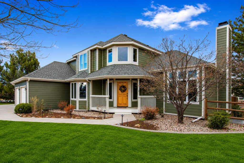Fort Collins, Colorado home featuring James Hardie fiber cement siding in Mountain Sage with Cobblestone trim installed by Northern Lights Exteriors. The exterior remodel showcases durable lap siding, contrasting trim details, and a timeless Craftsman-inspired design engineered for Colorado weather conditions.