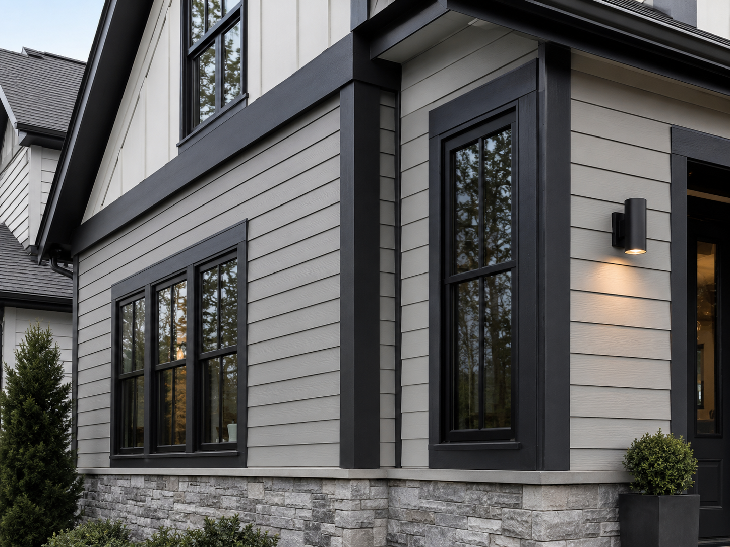 White and gray siding house with black trim and black windows