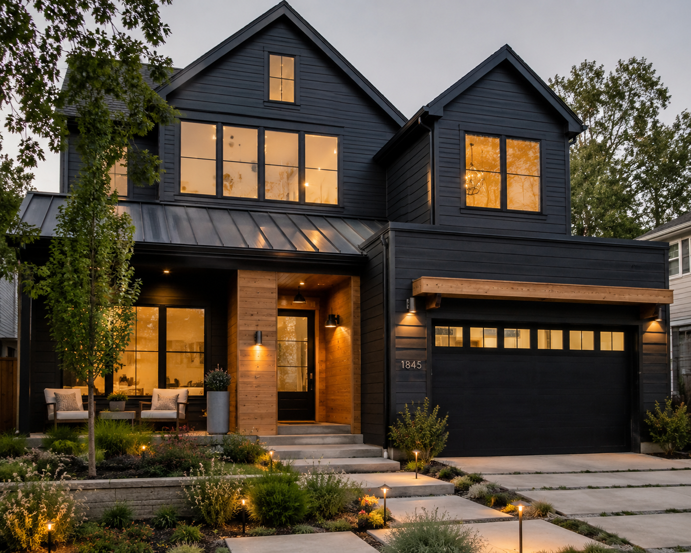 Modern custom home featuring James Hardie Midnight Black fiber cement siding with natural wood accents, black windows, and contemporary architecture for exterior design inspiration.