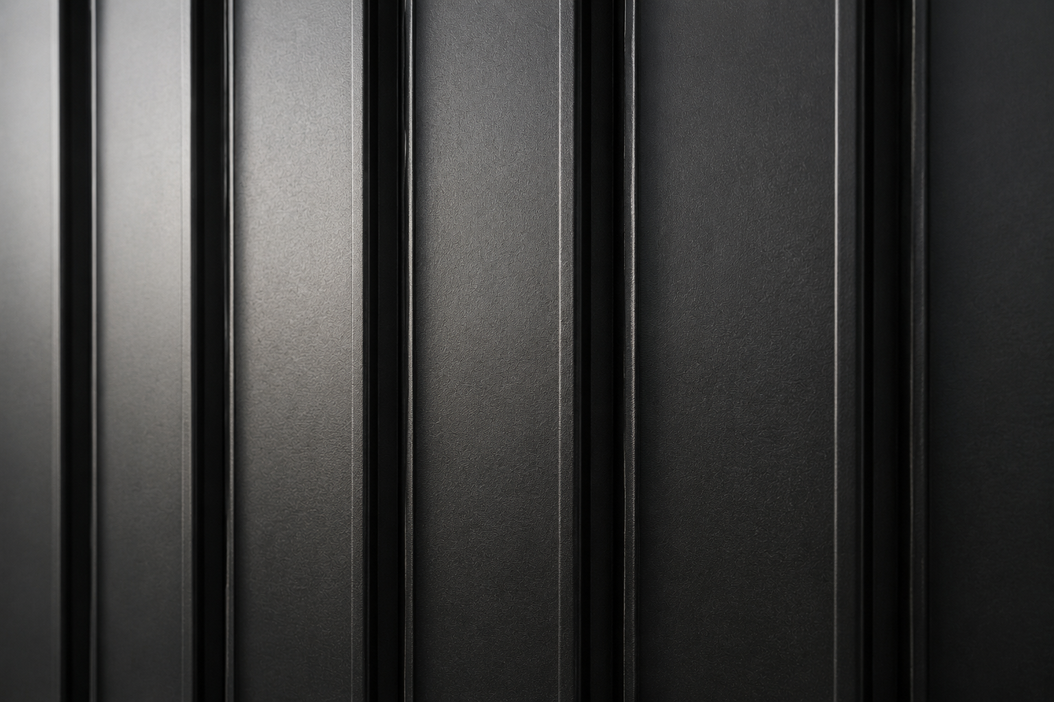 Vesta black steel siding vertical plank close up