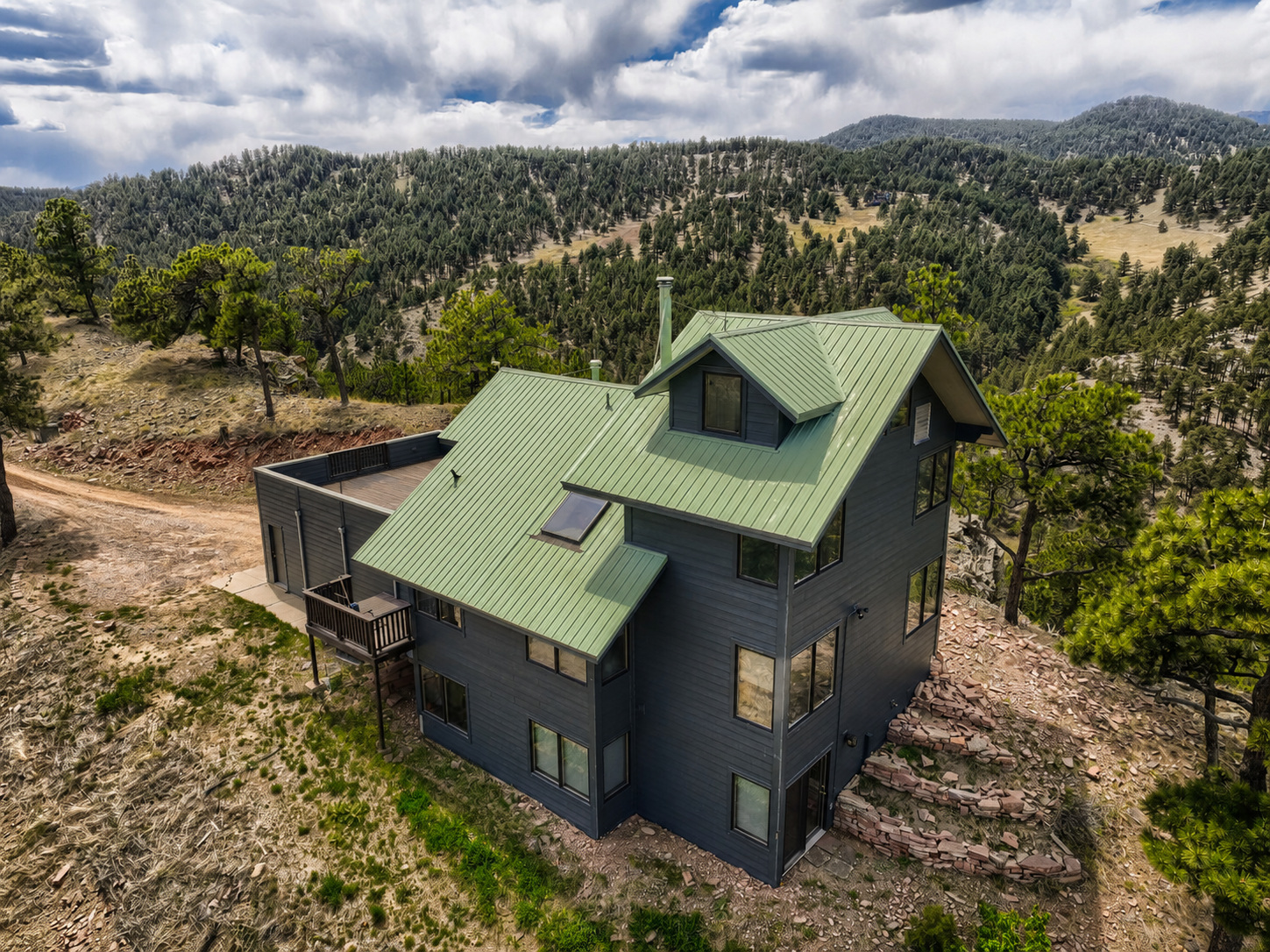 Boulder-area foothills home in the forested hills where Northern Lights Exteriors installed James Hardie Class A fire-rated fiber cement siding