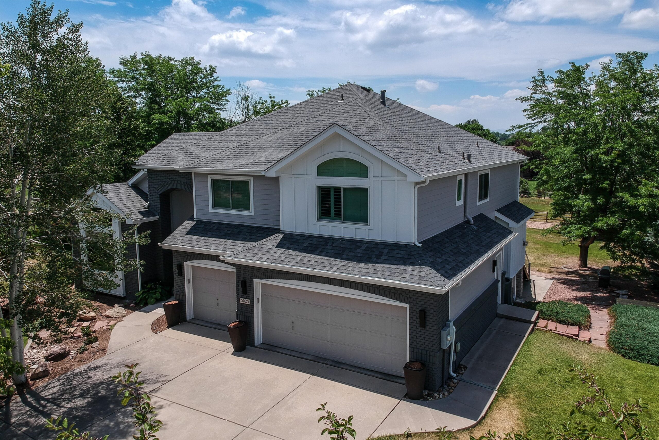 James Hardie Arctic White board and batten gable accent with Pearl Gray lap siding on a Fort Collins Colorado home