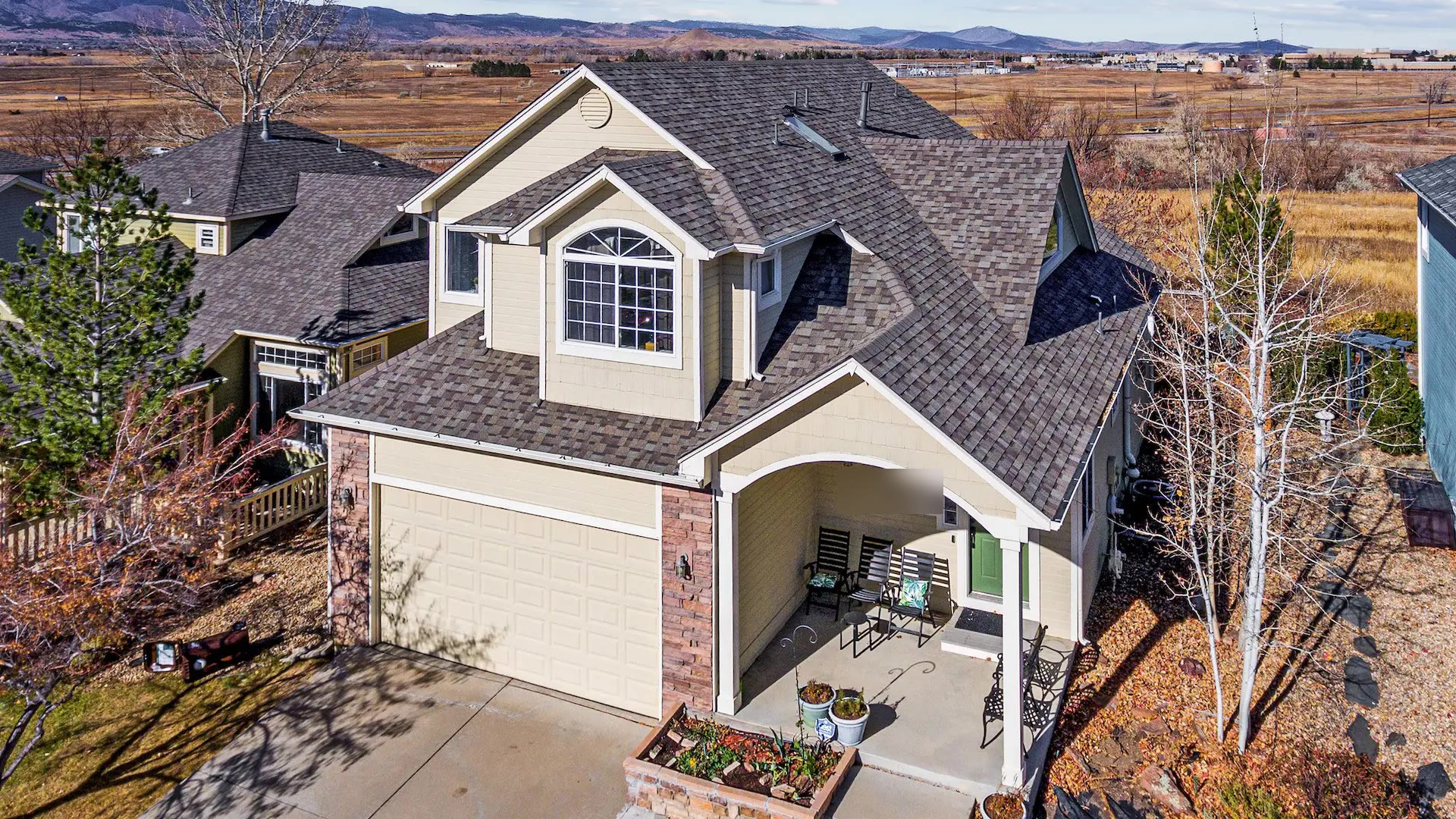 Colorado two-story home with a completed architectural shingle roof replacement by Northern Lights Exteriors