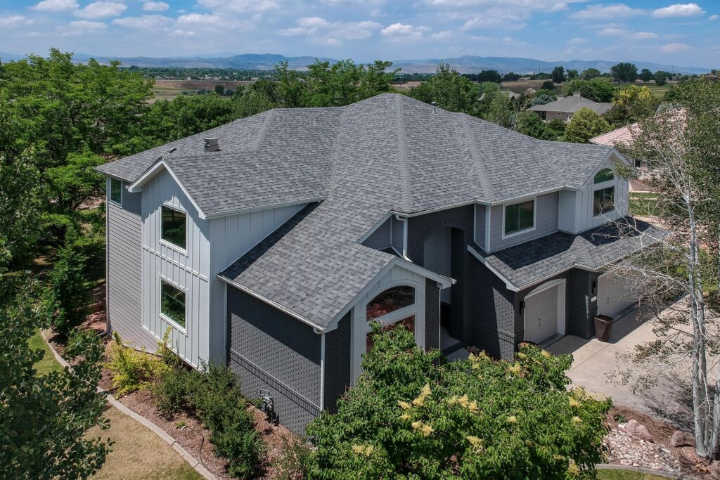 Northern Colorado home with James Hardie siding in Pearl Gray and Arctic White trim
